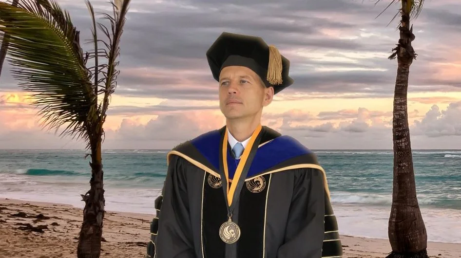 Maksim Godovykh in doctoral regalia